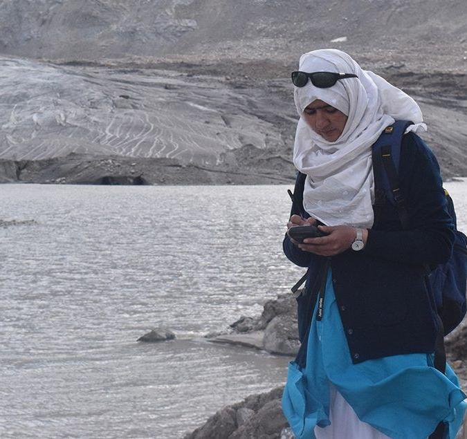 Majeed taking GPS measurements at the proglacial lake